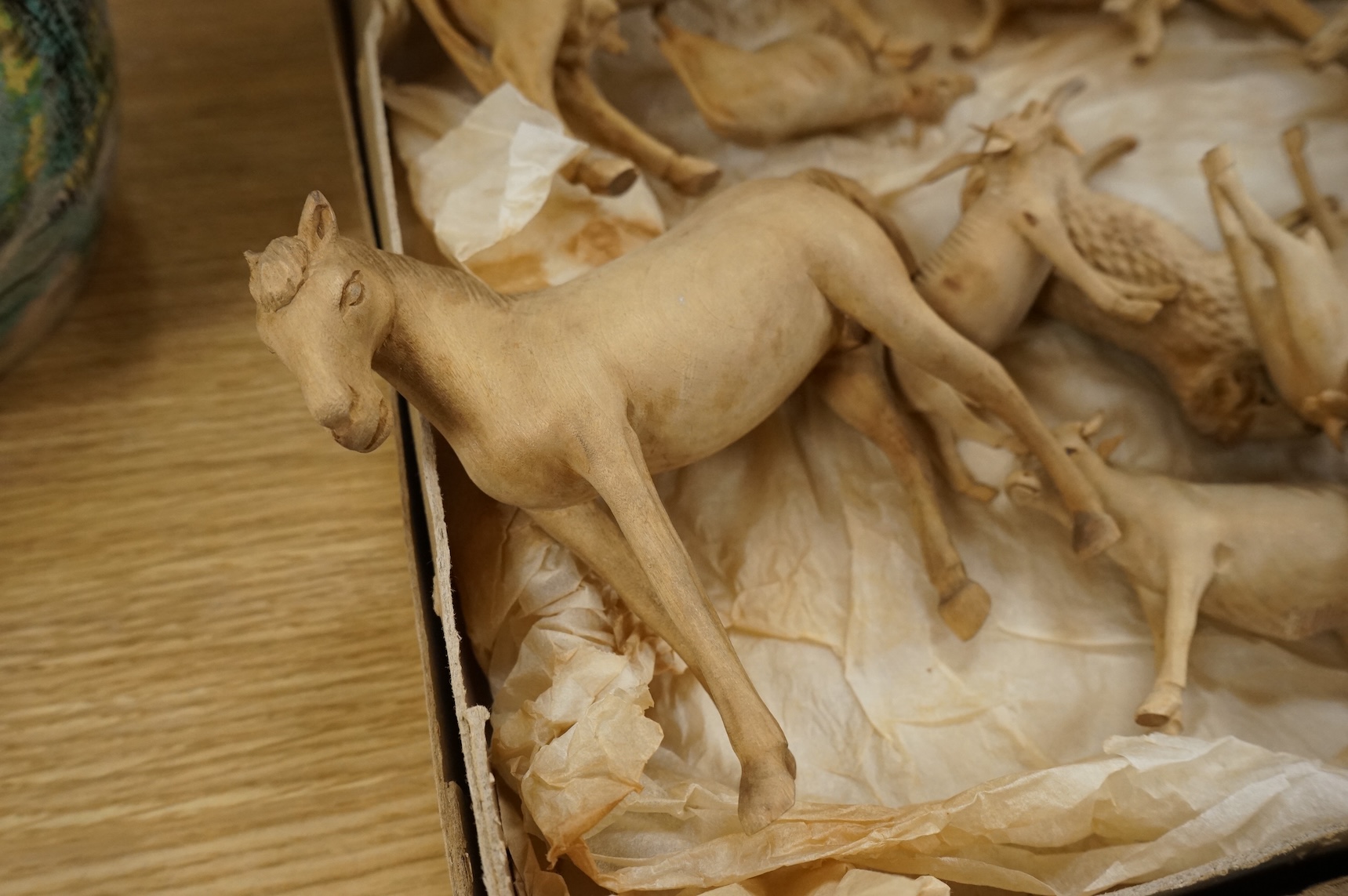 A collection of carved wood farm animals, largest 15.5cm